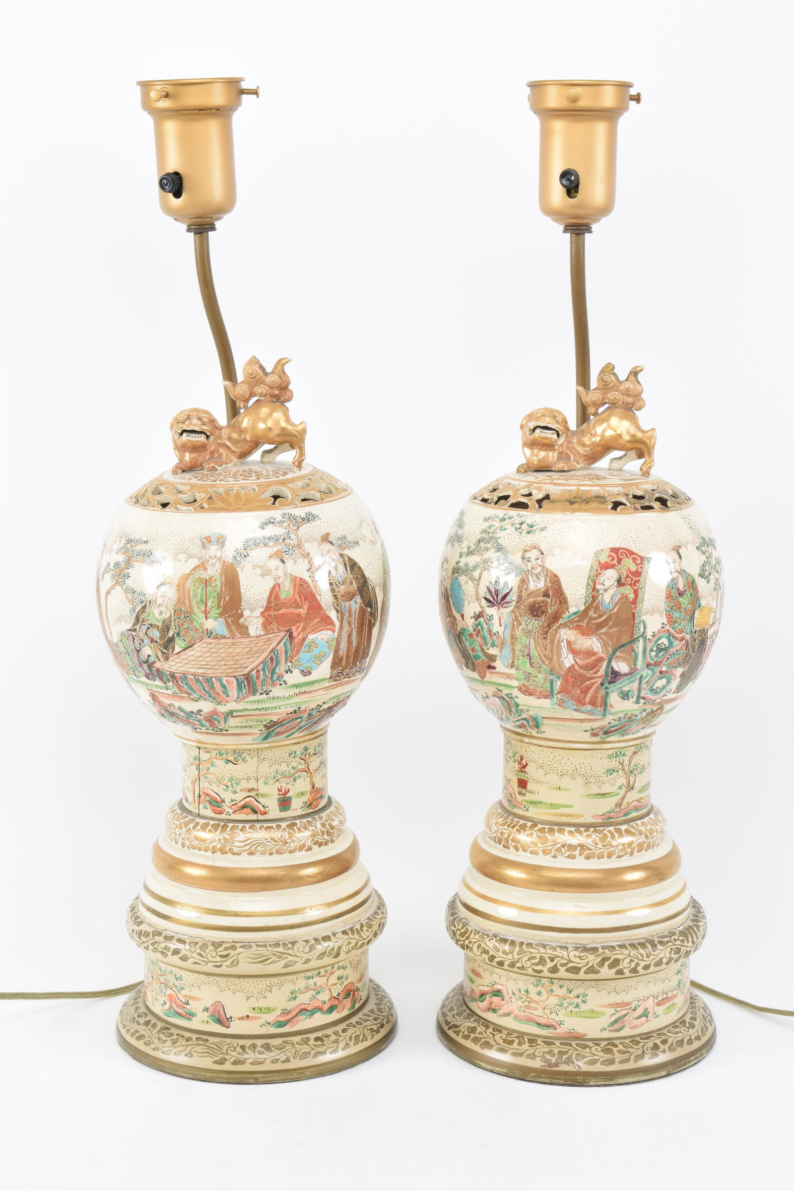 Pair of stoneware incense burners. Japan. Meiji period: Pair of stoneware incense burners. Japan. Meiji period (1868-1912). Satsuma ware. Decoration of scholars in a garden. Cracks and repairs. 18in high. Drilled and mounted as lamps.