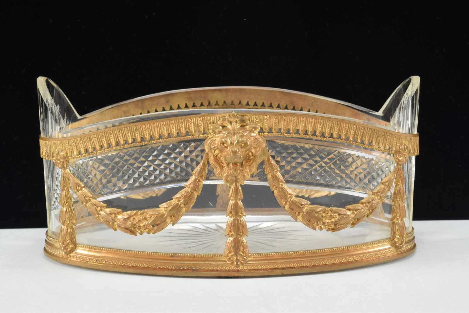Baccarat cut glass jardiniere with lion head motif: Baccarat cut glass jardiniere with lion head motif bronze ormolu. 7" x 4" x 3.5". Light surface wear.