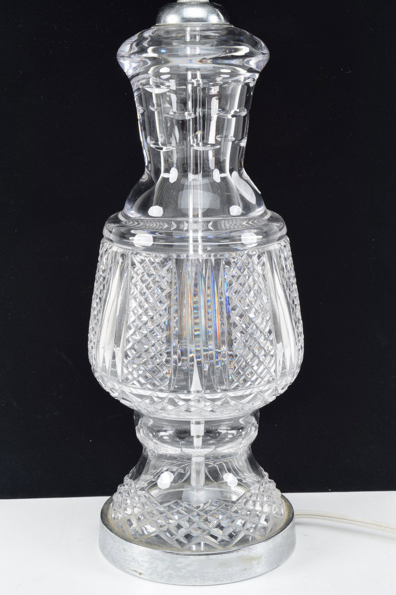 Waterford crystal table lamp. Working. 17in high: Waterford crystal table lamp. Working. 17in high without harp. Small ding to surface on one side.