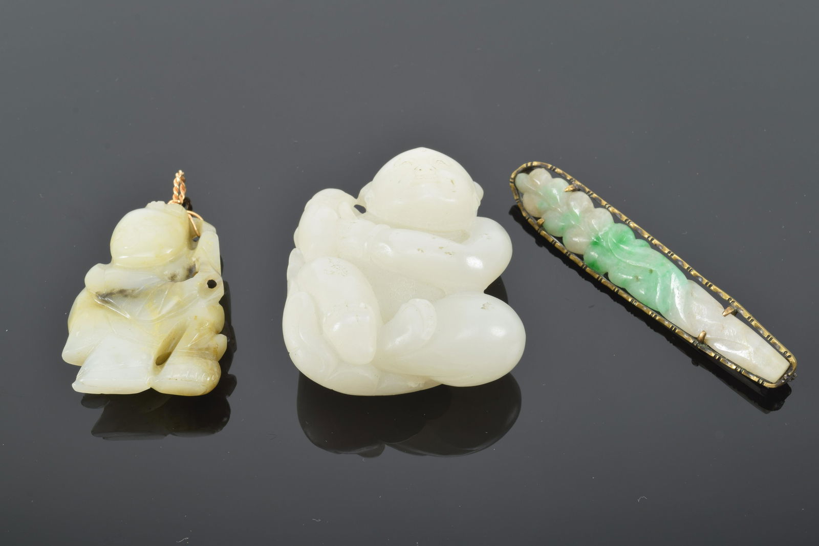 Jade Buddha figures and Chinese jade leaf pin. 20th (1 of 7)