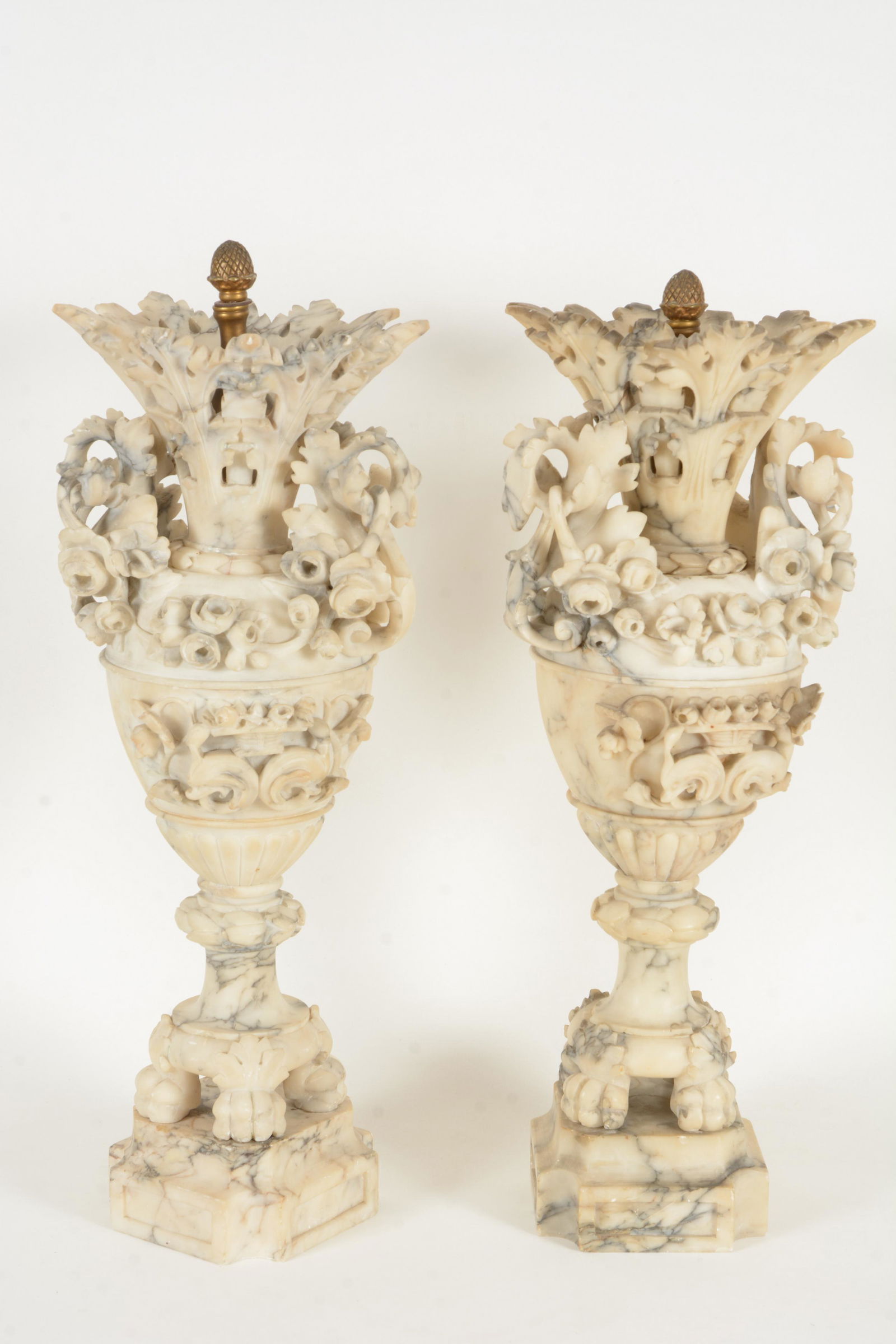 Pair of marble urns carved with floral arrangements and (1 of 14)