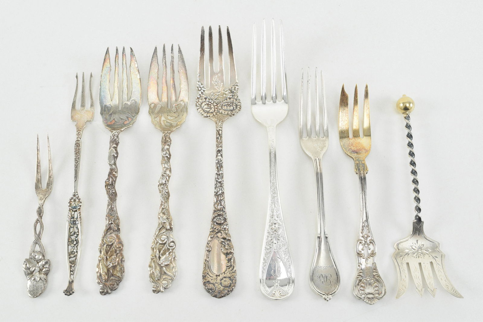 9 ornate sterling silver serving forks. Includes pair (1 of 9)