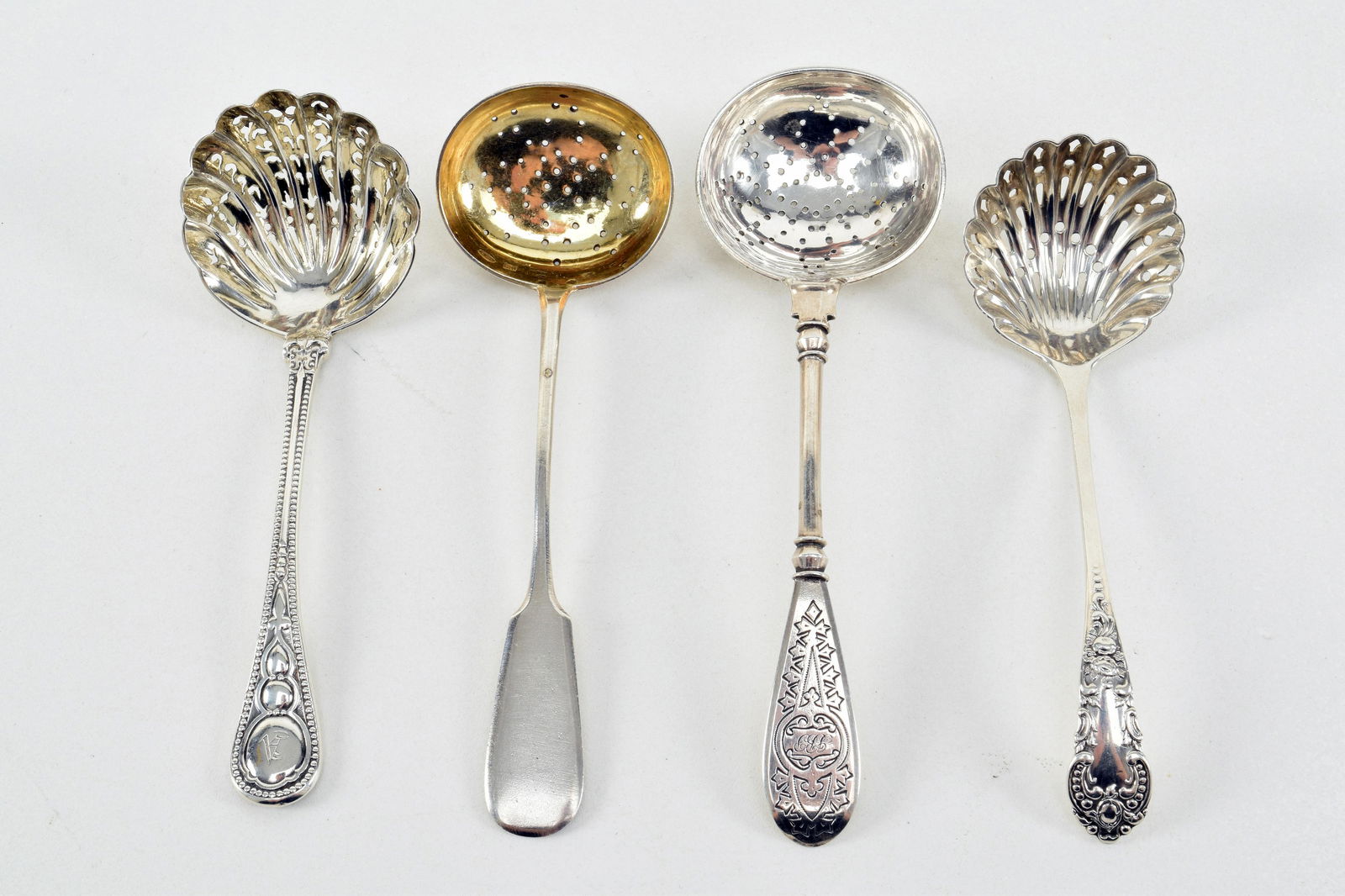 Russian and English silver sugar sifters. To include: (1 of 12)