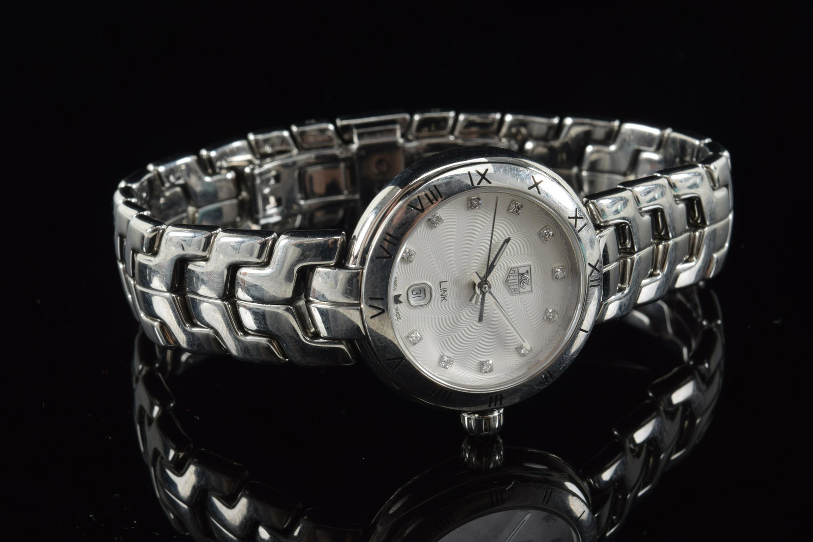 Ladies Stainless steel wristwatch, Tag Heuer, date: Ladies Stainless steel wristwatch, Tag Heuer, date window and diamond numerals.