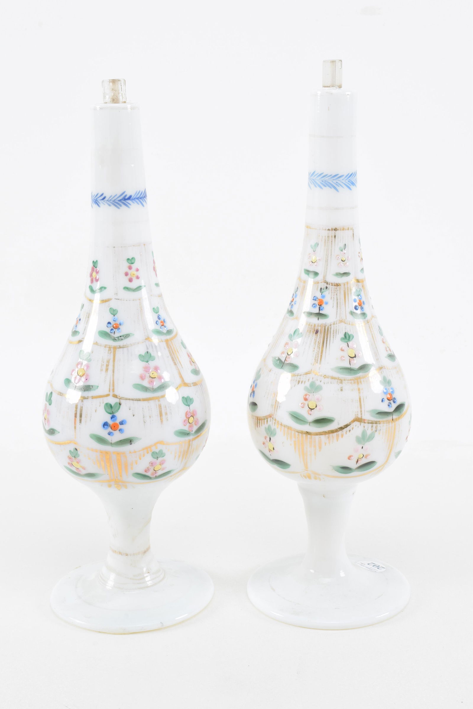Pair of footed bottles. Enameled opalescent glass. (1 of 9)