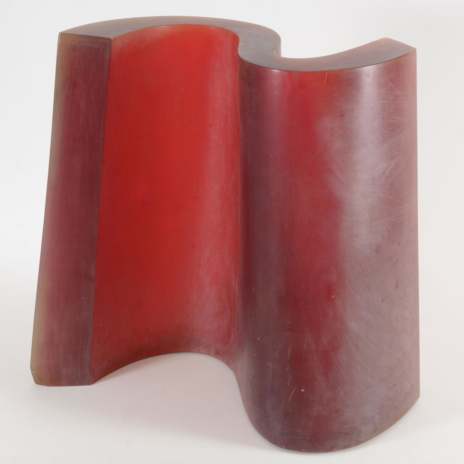 John McCracken, attributed to. Curvilinear sculpture in: John McCracken, attributed to. Curvilinear sculpture in dark red to crimson tones. Heavy resin material. Provenance states that the piece was acquired from Bakker auctions in 1991, was ex Chrysler Mus