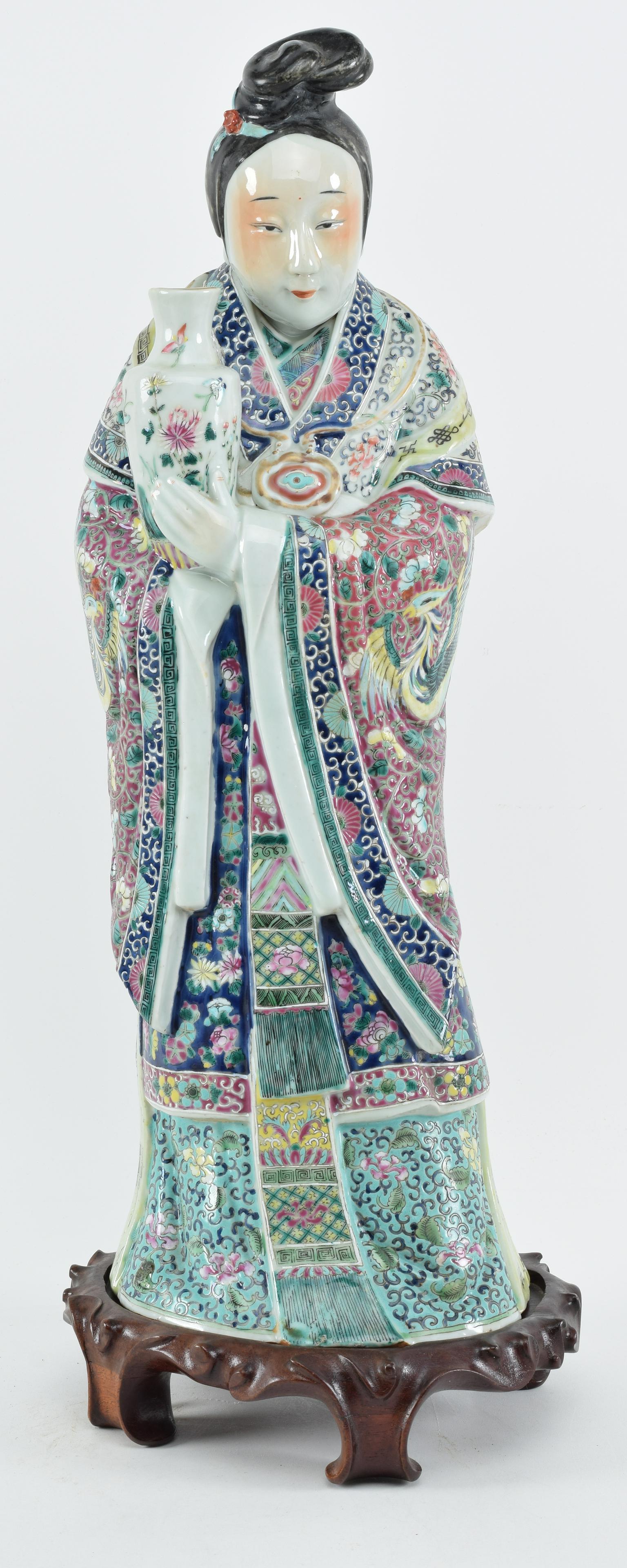 Porcelain figure of the goddess of mercy, Kuan Yin. (1 of 11)