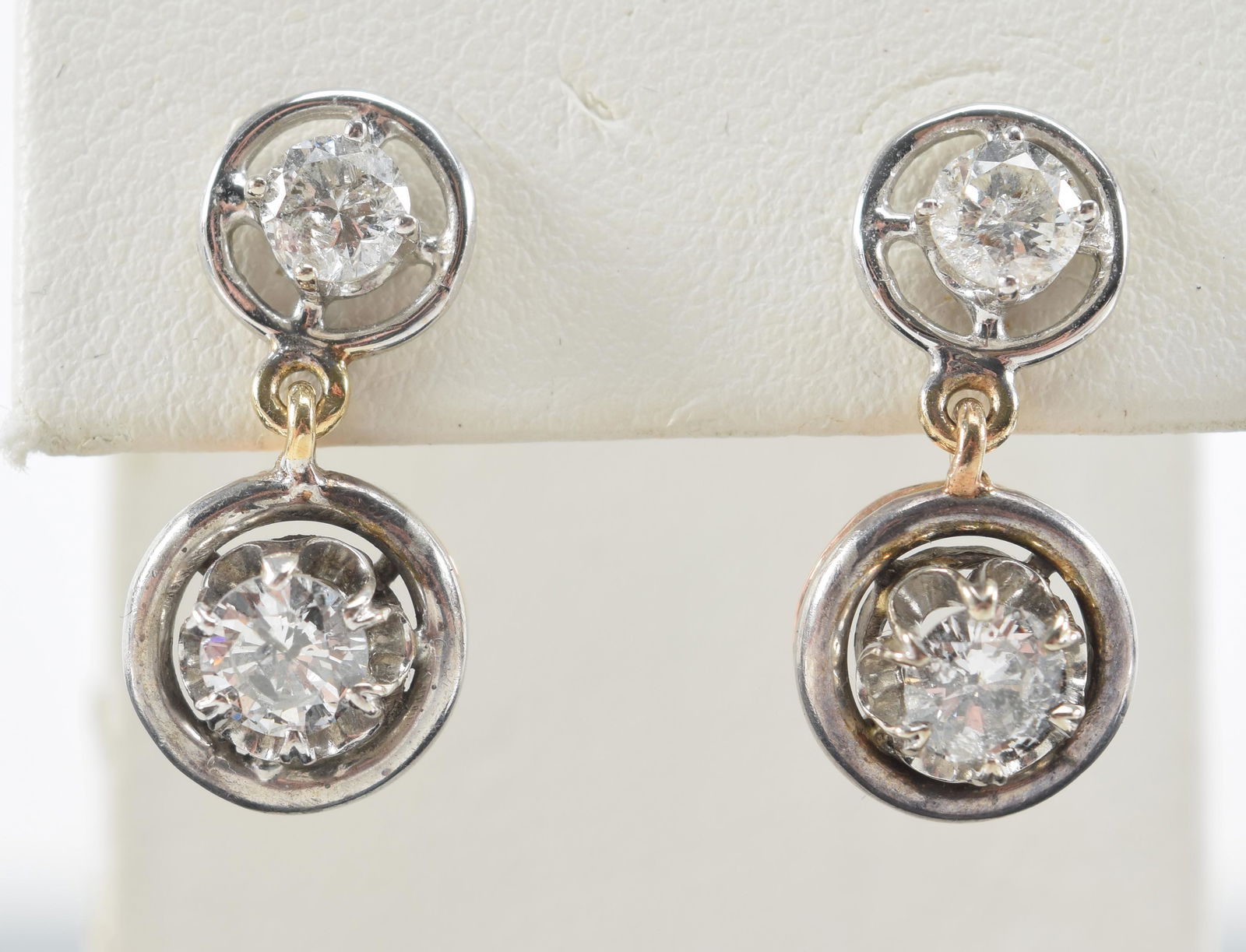 Pair of 14kt gold diamond stud drop earrings. White and (1 of 8)