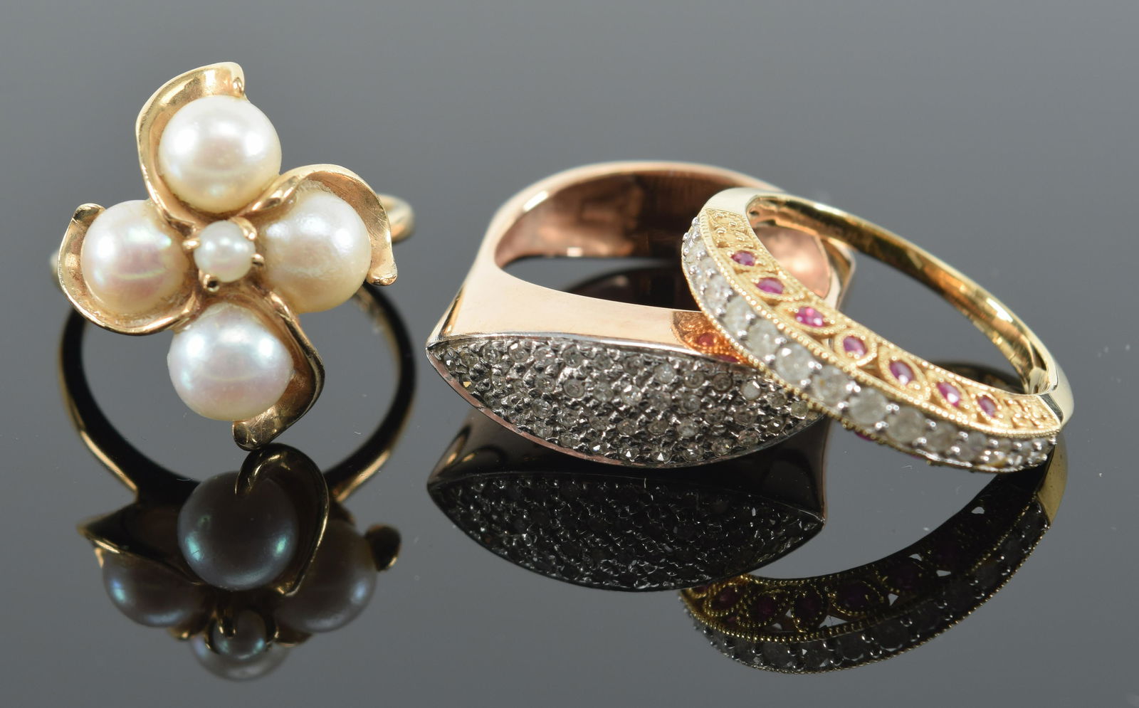 3 yellow gold rings. To include: 1) 14K diamond and (1 of 12)