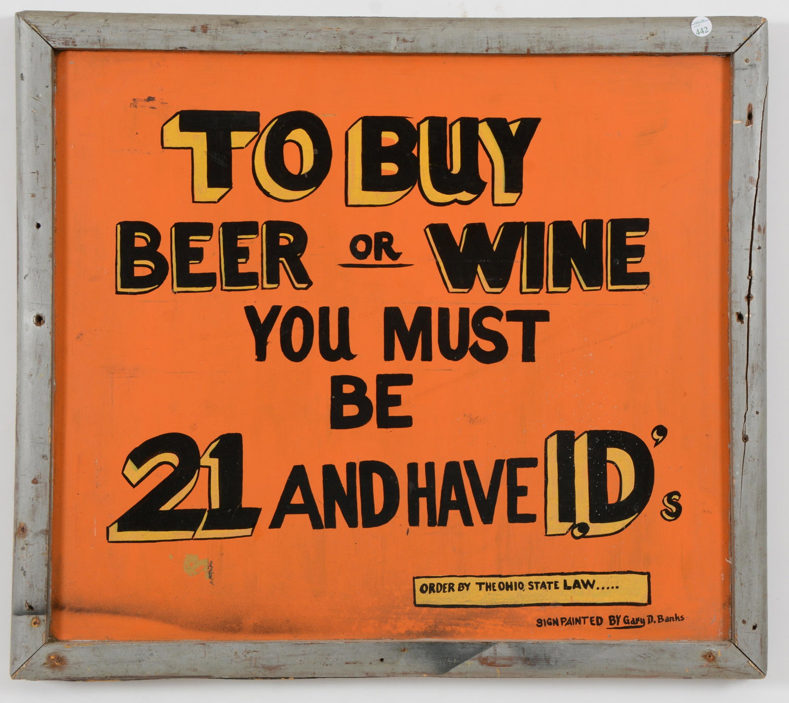 Mid-20th century hand painted alcohol I.D. store sign.: Mid-20th century hand painted alcohol I.D. store sign. Reads "To Buy Beer or Wine you must be 21 and have I.D's". Painted by Gary D. Banks. Black and yellow lettering on an orange ground. Heavy wooden
