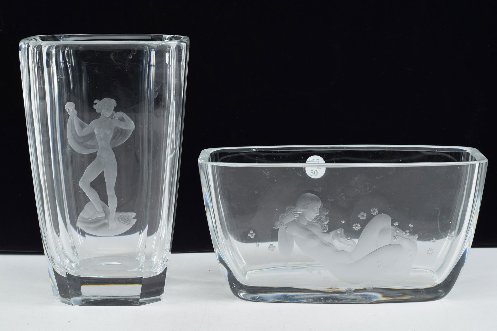 Orrefors Palmquist etched glass dish and vase. Each: Orrefors Palmquist etched glass dish and vase. Each with a nude woman in pose. Signed to undersides. Vase: 9.5in high. Dish: 10.25in wide. Vase with small chip to rear base edge. Light scuffs and wear