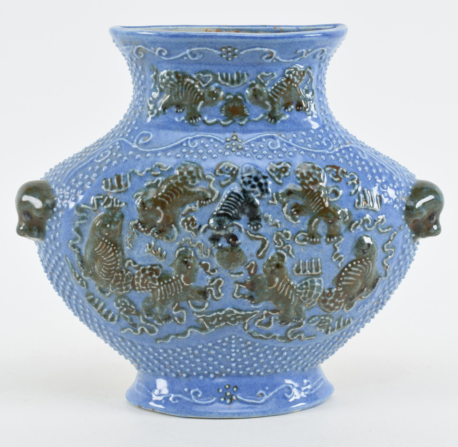 19th century Chinese blue ground porcelain wall vase: 19th century Chinese blue ground porcelain wall vase with relief buddhist lion decoration. Ming mark on base. 8.5in high.