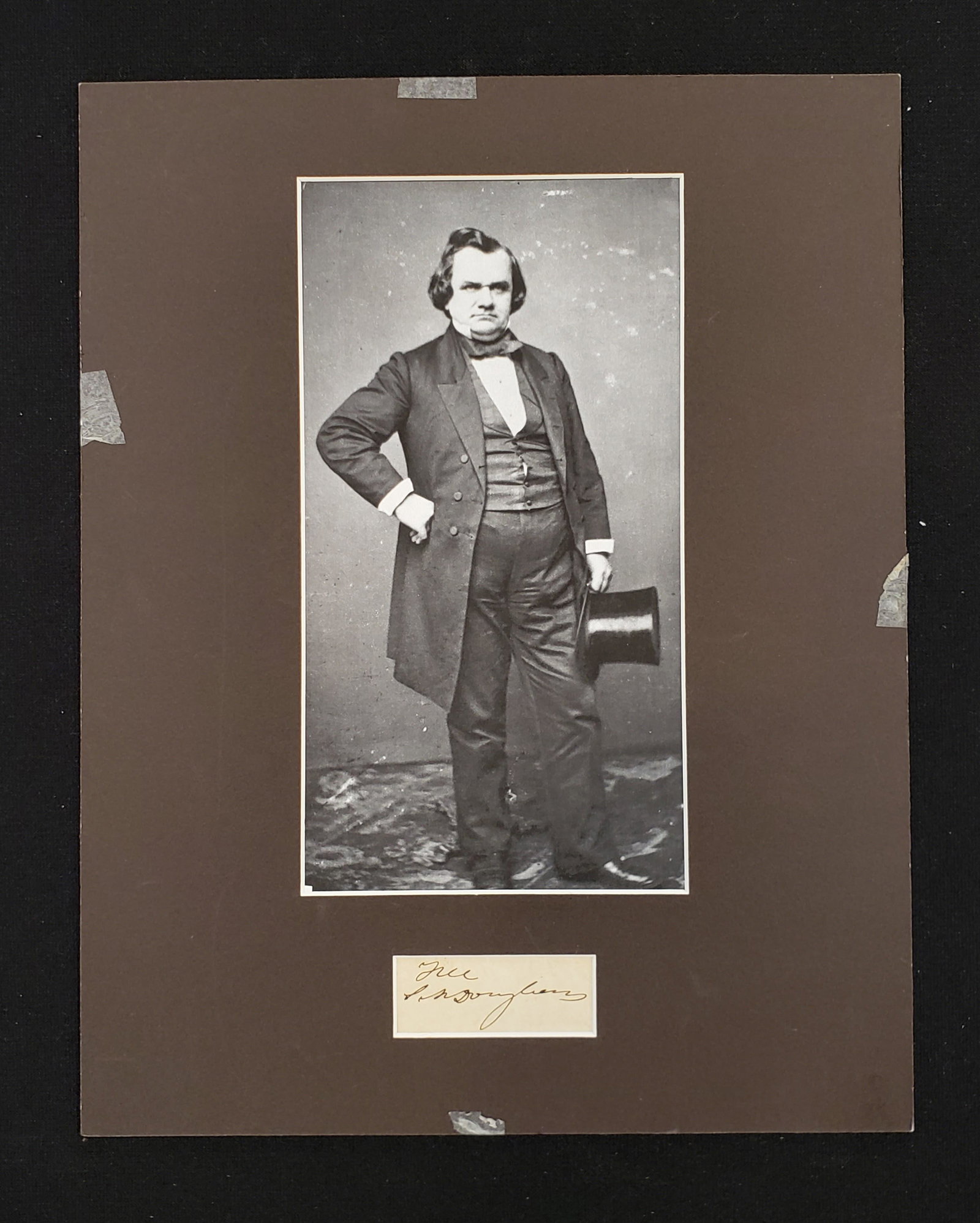 Illinois Senator Stephen Douglas Autograph Signature.: Illinois Senator Stephen Douglas Autograph Signature. Cut free frank signature mounted in matte display with copied photo of the senator. Overall 11 x 14.5 inches. Clipping is 1.5 x 3.5 inches, on per
