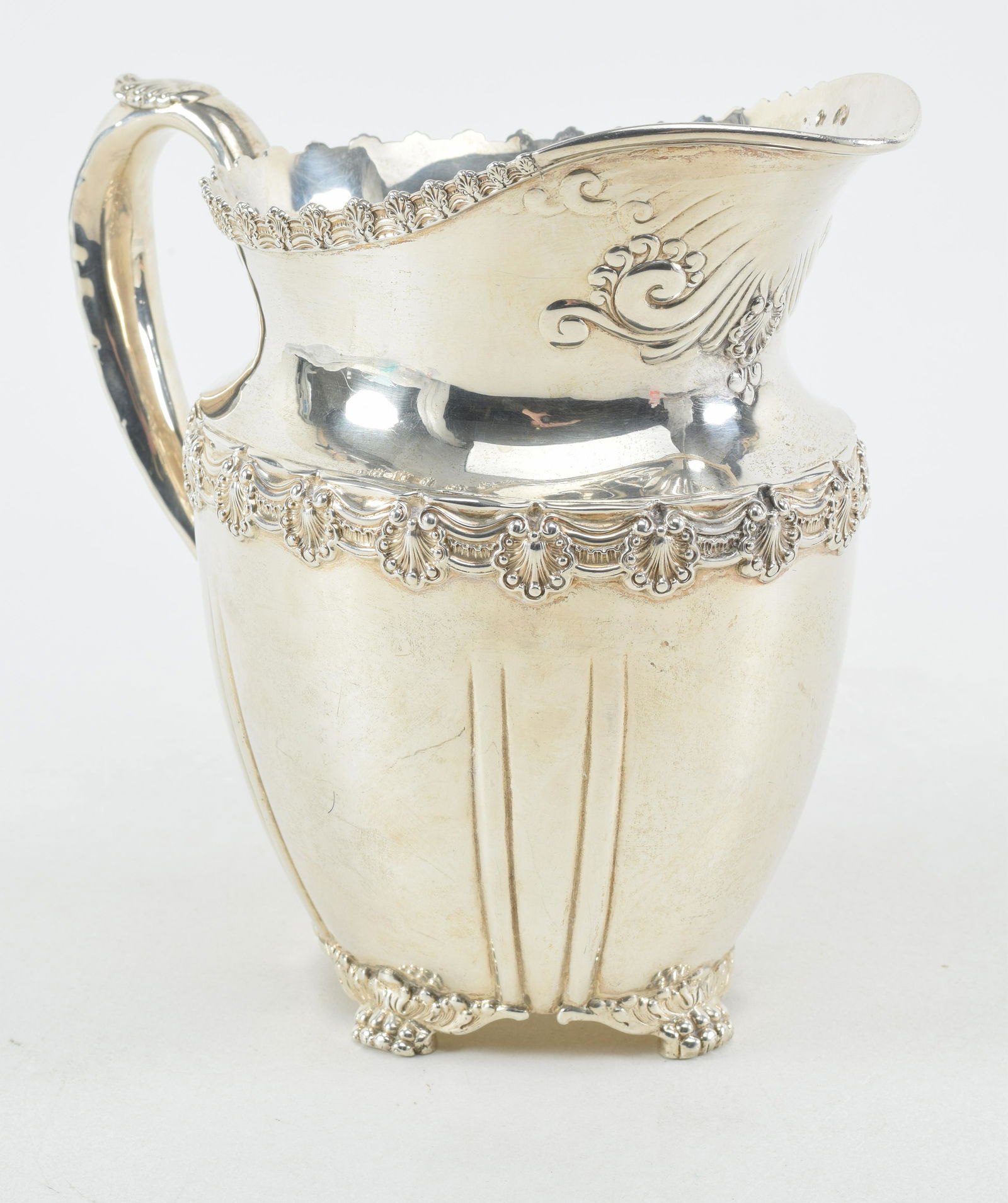Tiffany & Co. sterling silver 4 pint water pitcher. Repousse decoration of a garland with shell (1 of 9)