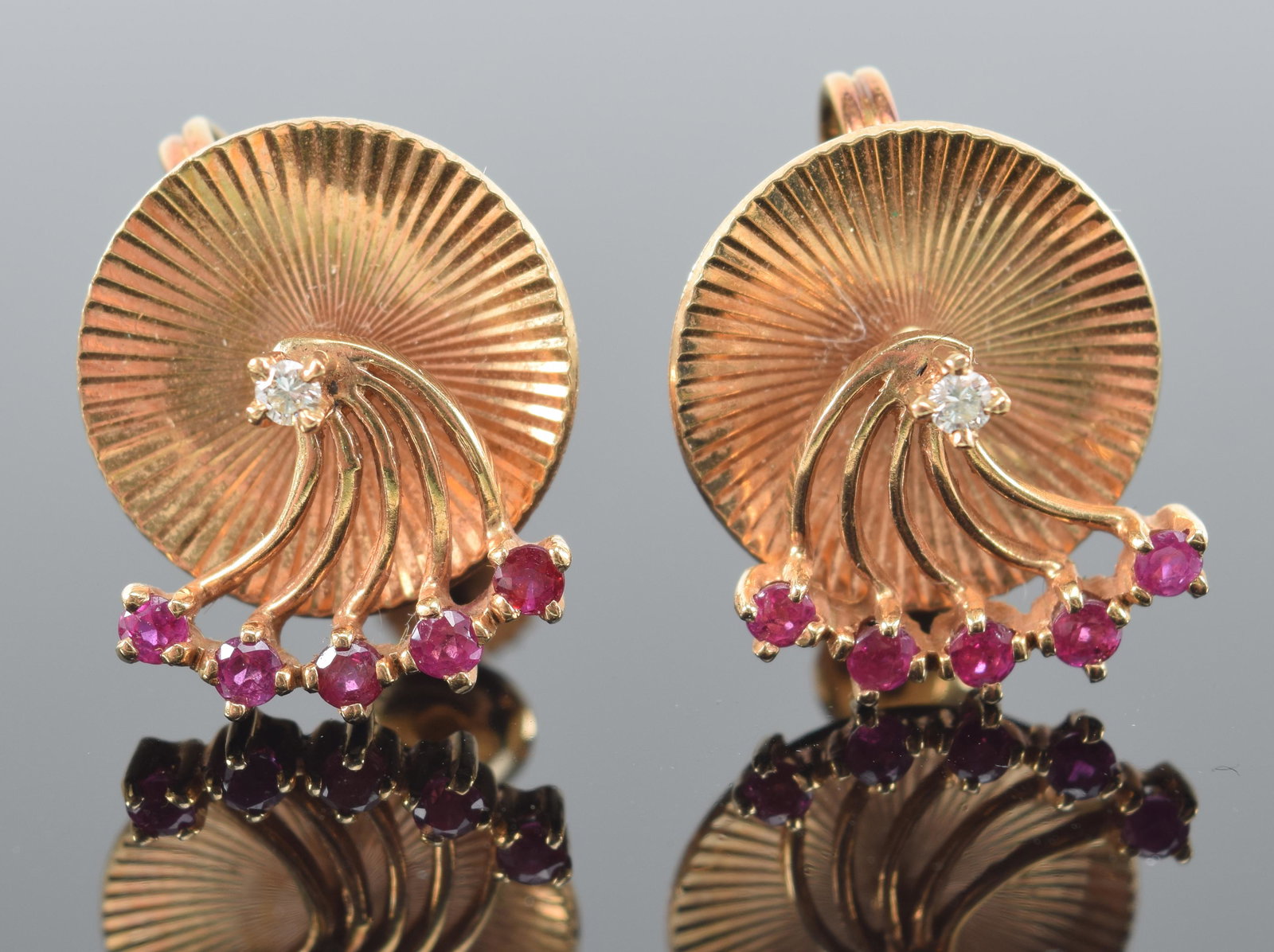 Tiffany & Co. 14K gold ruby and diamond earrings. Single diamond set above a reeded disc with 5 (1 of 3)