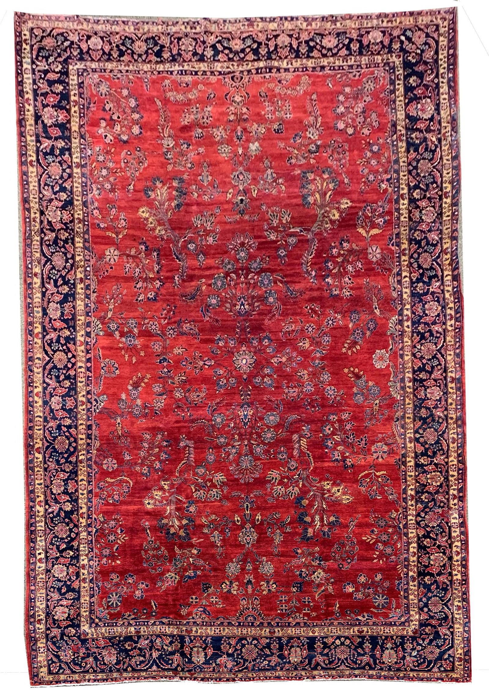 Sarouk roomsize carpet with wide floral borders around a cenral red field. 19' 3" x 12' (1 of 6)