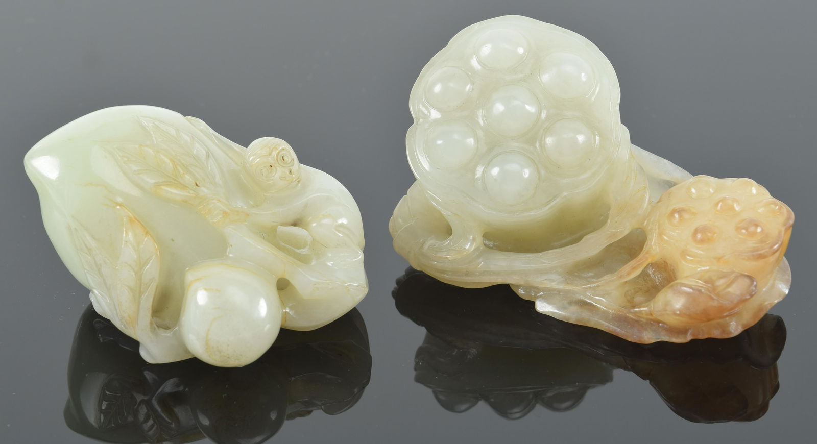 2 jade carvings. China. 19th/20th century. Study of peaches and one of a lotus plant. Largest 3in. (1 of 9)