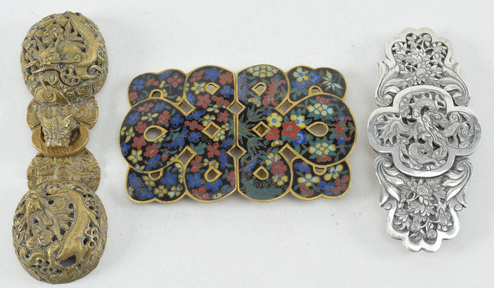 Lot of 3 belt buckles. China. 19th century. To include: brass with dragons, cloisonne and silver. (1 of 9)