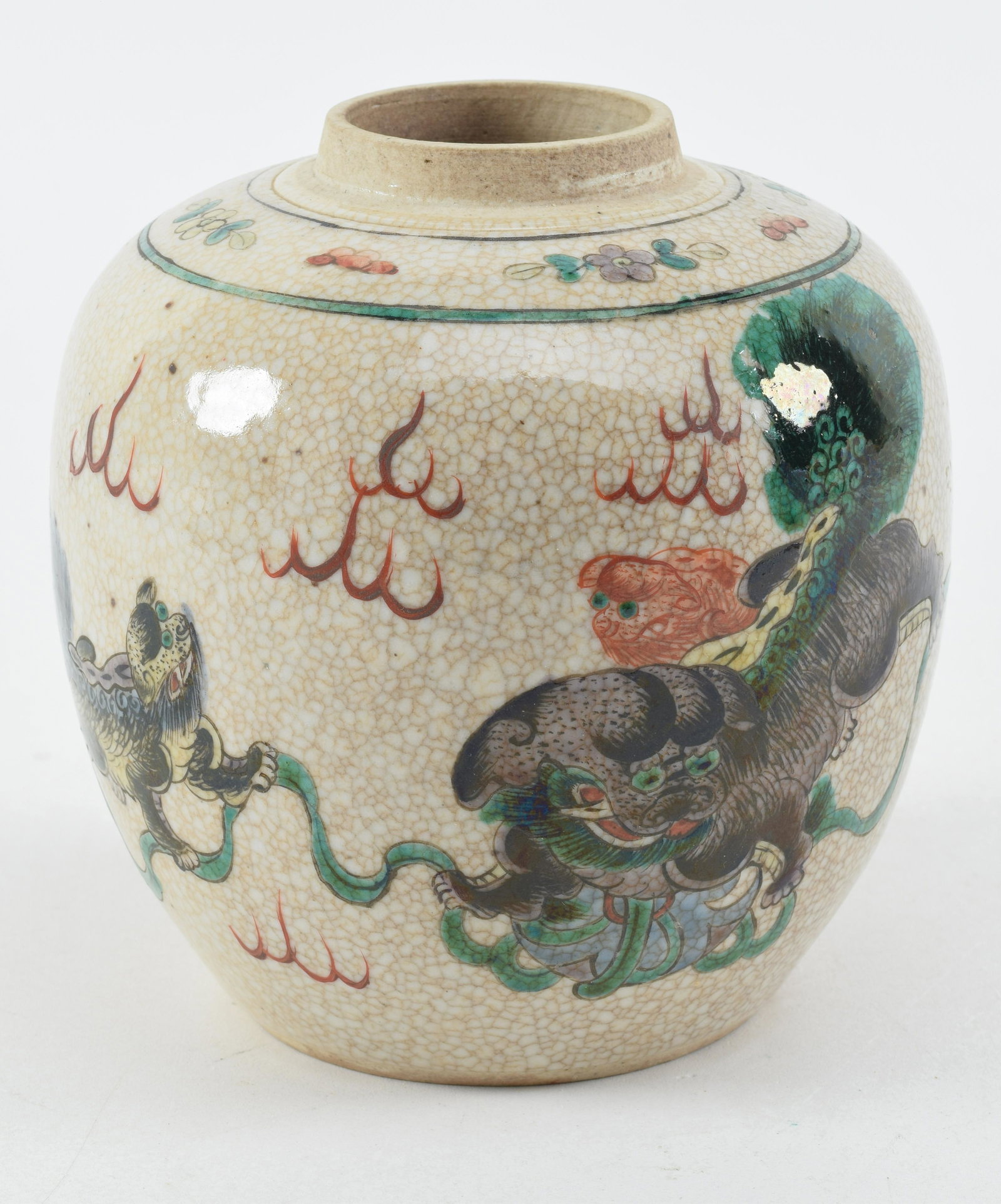 Porcelain ginger jar. China. Early 20th century. Ovoid form with famille verte decoration of foo: Porcelain ginger jar. China. Early 20th century. Ovoid form with famille verte decoration of foo dogs on a crackled ground. 6 x 5.5in.