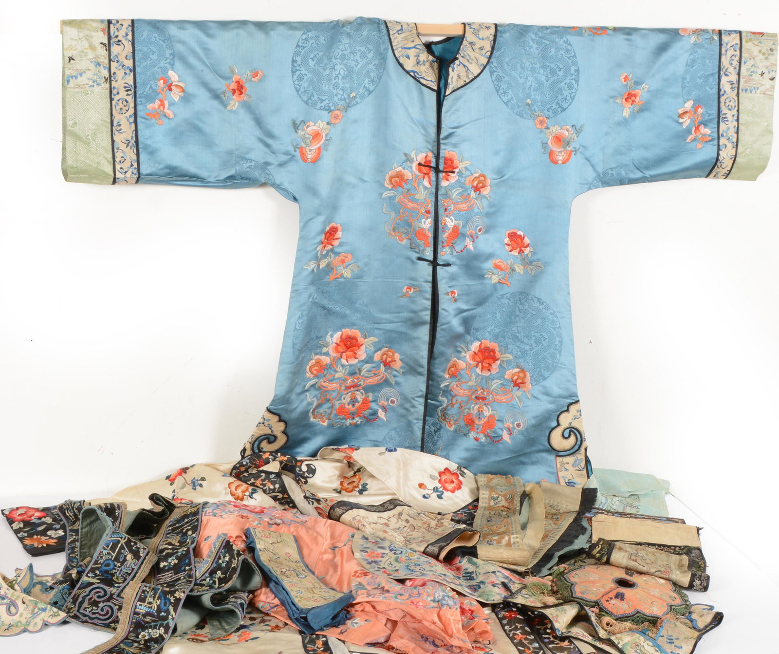 Lot of approx. 15 textiles. China. 19th/early 20th century. To include: 2 robes, sleeve panels, rank: Lot of approx. 15 textiles. China. 19th/early 20th century. To include: 2 robes, sleeve panels, rank badges, and fragments.