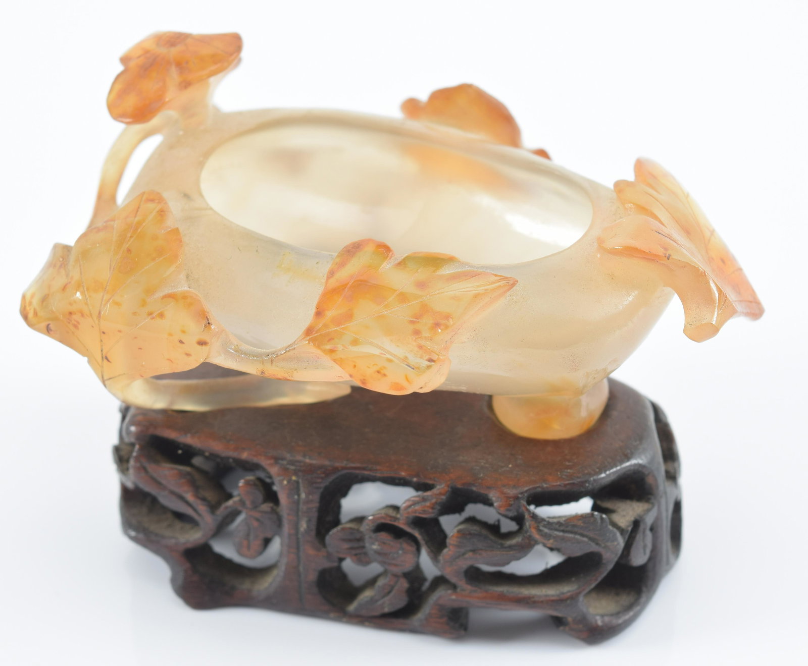 Water coupe. China. Early 20th century. Carnelian carved in high relief with foliage. 3.5in.: Water coupe. China. Early 20th century. Carnelian carved in high relief with foliage. 3.5in.