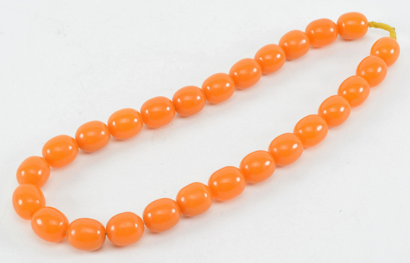 Set of amber beads. 28in length. Transluscent butterscotch color. (1 of 13)