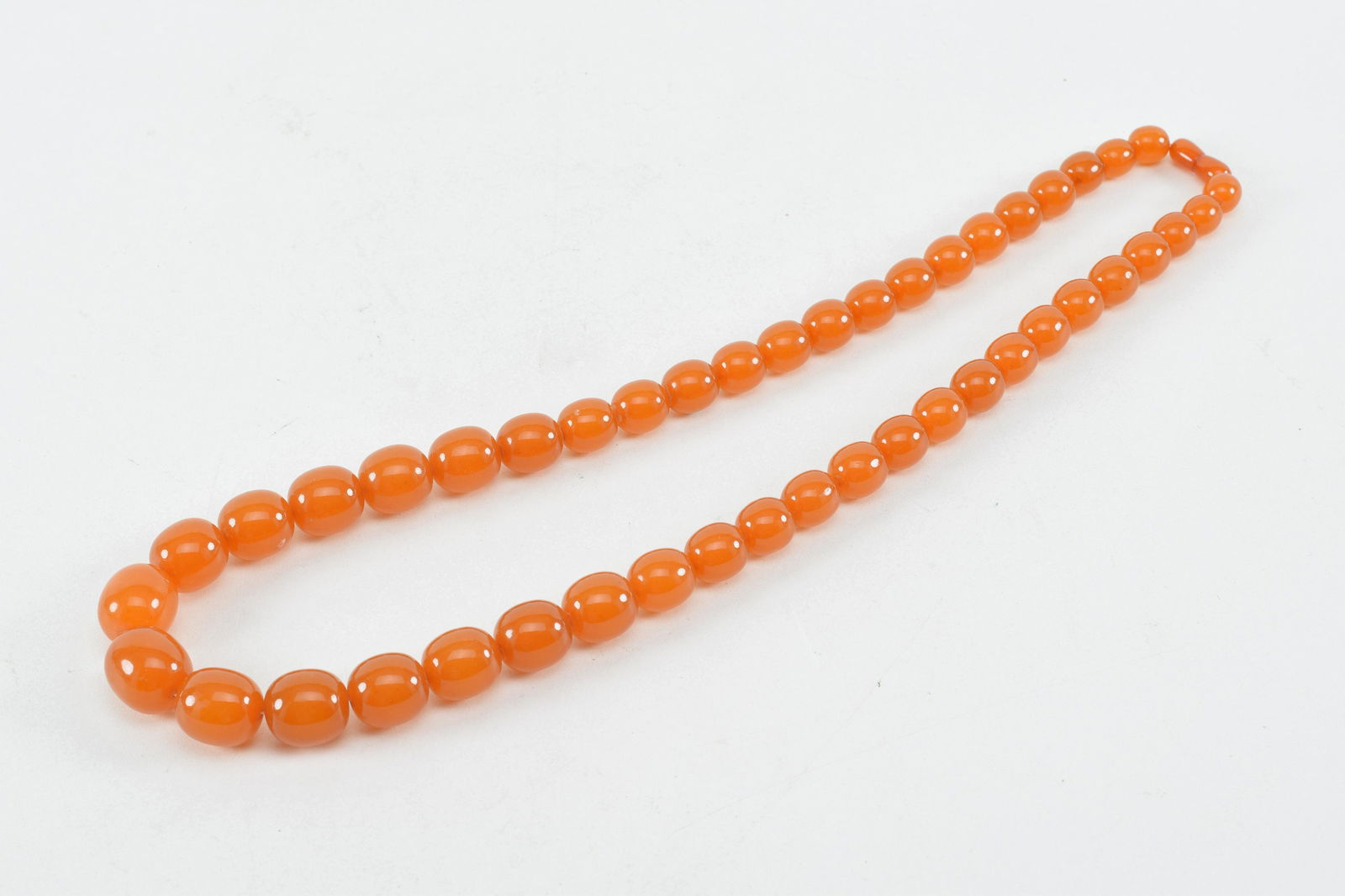Set of amber beads. 24in length. Transluscent butterscotch color. (1 of 6)