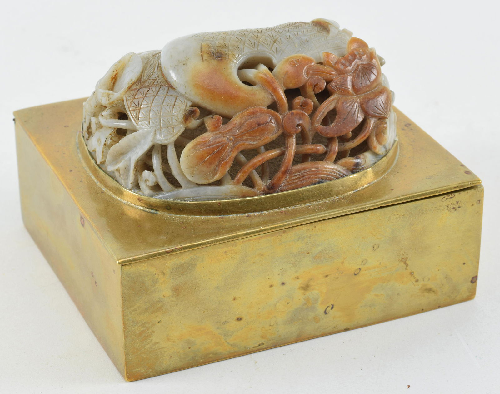 Jade carving. China. Ming period (1368-1644). Stone of a grey color with large russet markings. (1 of 8)