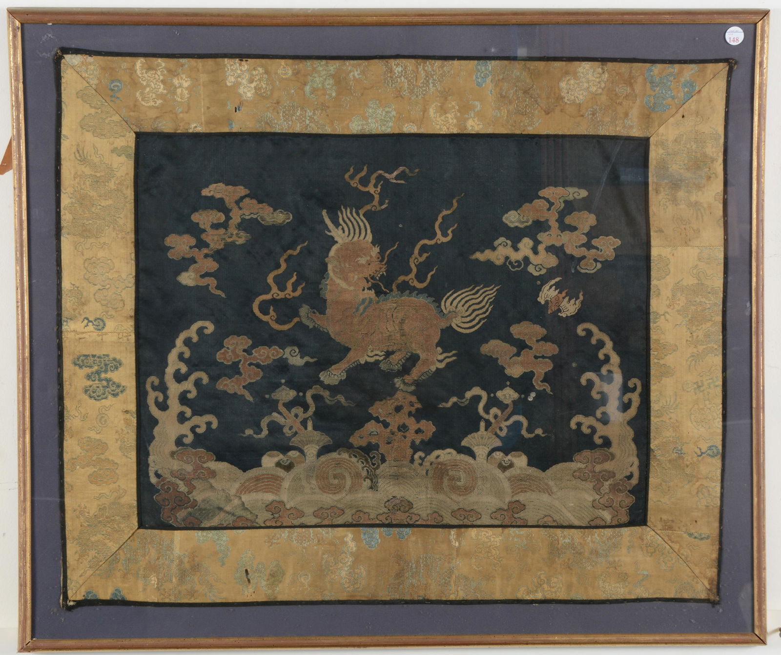 18th/19th century Chinese embroidered linen with buddhist lion and cloud decoration. Framed under (1 of 6)