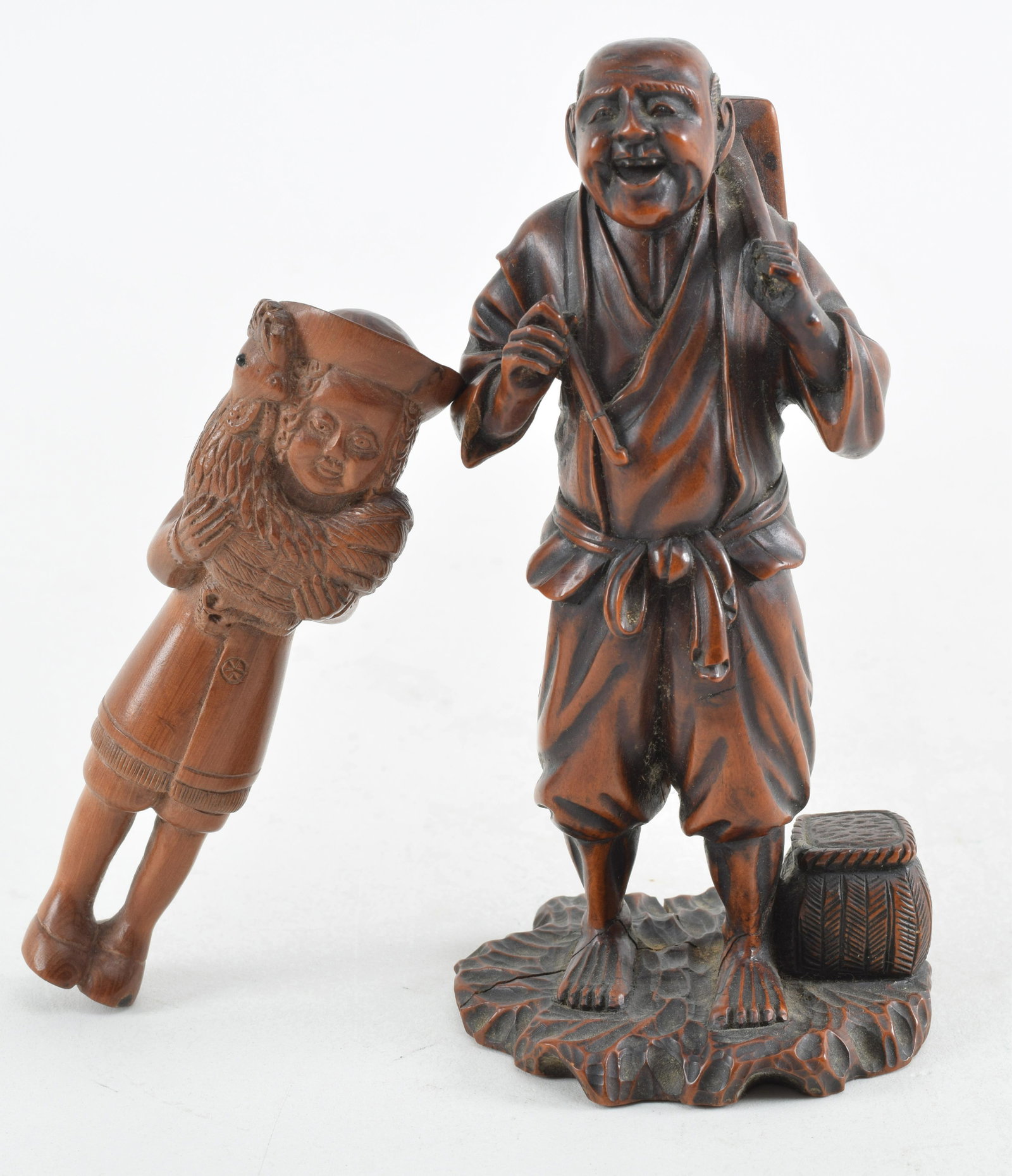 2 boxwood carvings. Japan. To include a boxwood carving of a farmer signed Kogetsu. Meiji period: 2 boxwood carvings. Japan. To include a boxwood carving of a farmer signed Kogetsu. Meiji period (1868-1912). 6in high. Crack. And a 20th century netsuke of a european with a cockeral. 4.25in.