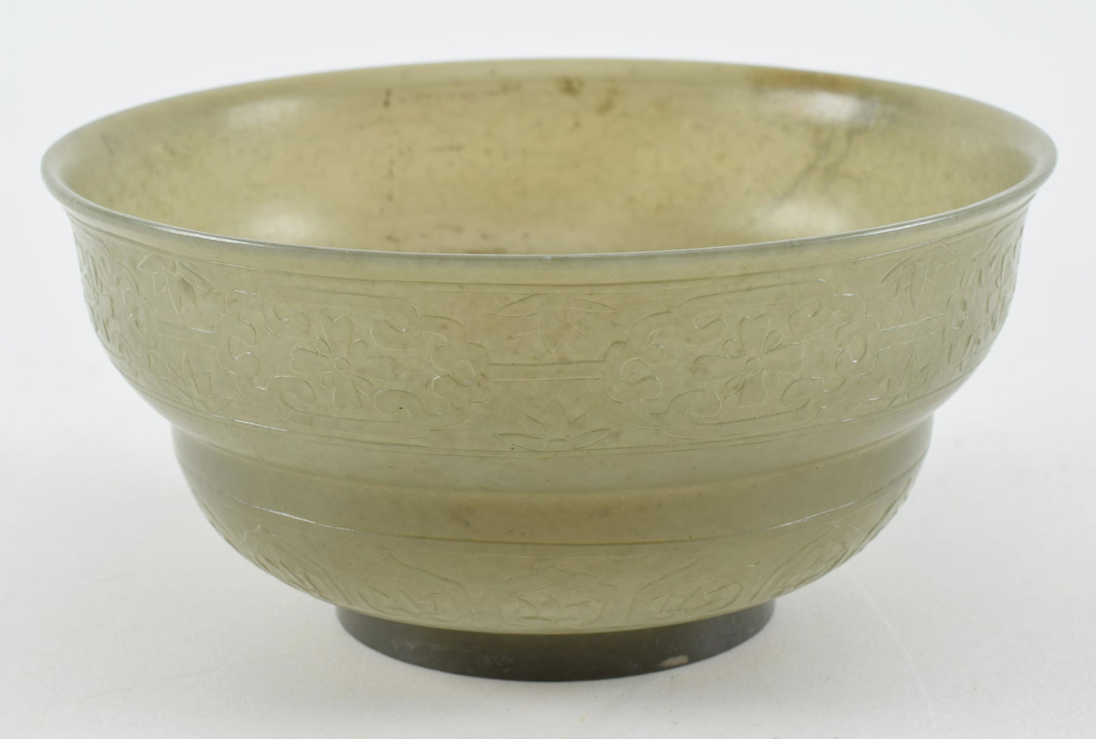 Jade bowl. China. 20th century. Dark celadon color. Surface carved in low relief with floral (1 of 6)