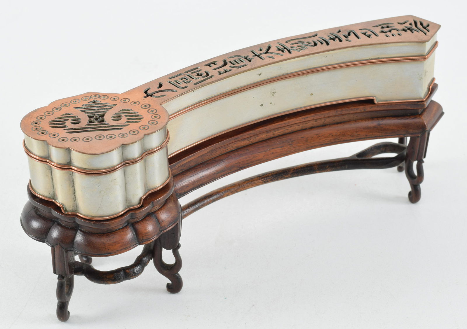 Incense clock. China. 19th/early 20th century. Ju-i shaped with pierced characters. Fitted stand. (1 of 6)