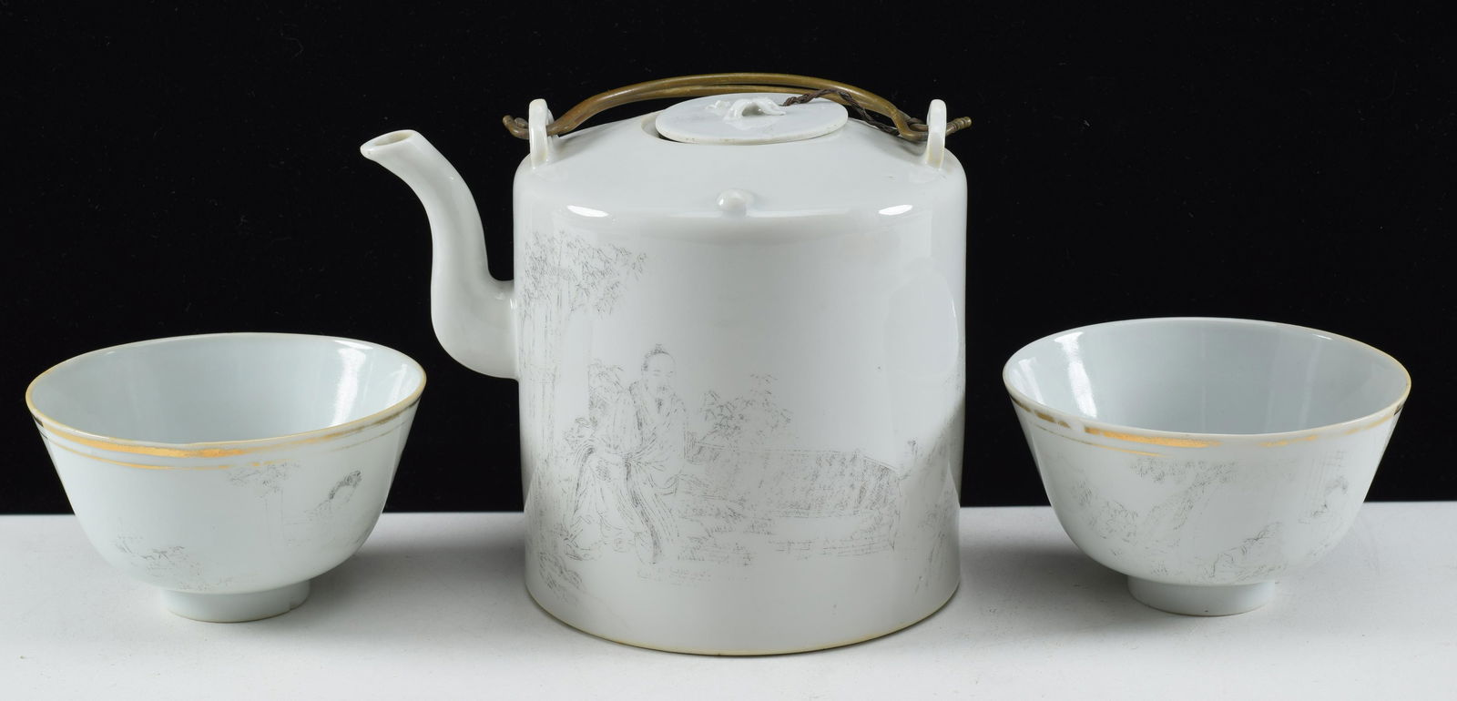 Porcelain tea set. China. Early 20th century. Teapot and 2 cups. Grissaille decoration of scholars.: Porcelain tea set. China. Early 20th century. Teapot and 2 cups. Grissaille decoration of scholars. Teapot: 6.25 x 5.25in.
