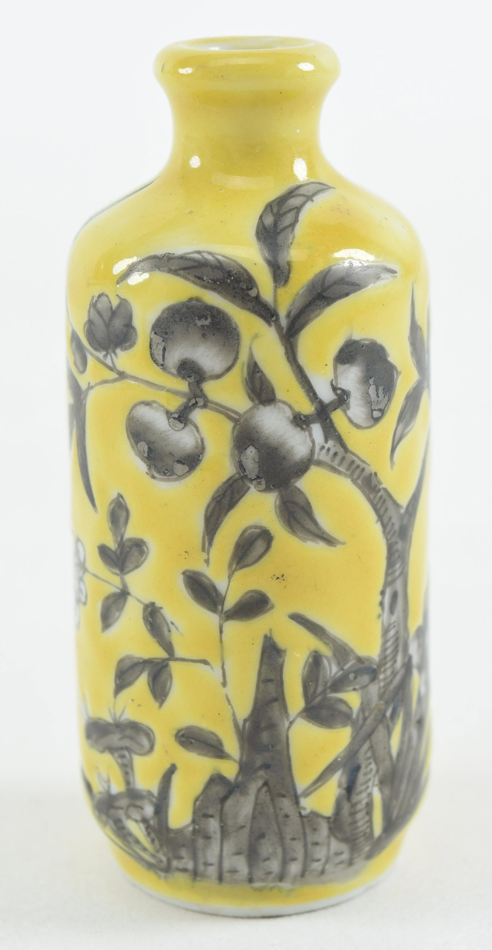 Porcelain snuff bottle. China. 19th/20th century. Ta Ya Chai type. Cylindrical form with grissaille: Porcelain snuff bottle. China. 19th/20th century. Ta Ya Chai type. Cylindrical form with grissaille foliage on a yellow ground. 3in. Chien Lung mark. From a 100-year-old Newport, Rhode Island collecti