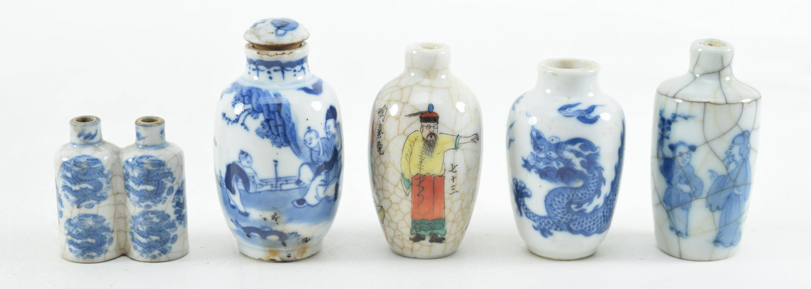 5 snuff bottles. China. 19th/Early 20th century. Underglaze blue decoration, one with famille rose: 5 snuff bottles. China. 19th/Early 20th century. Underglaze blue decoration, one with famille rose decoration. Largest 2.75in. From a 100-year-old Newport, Rhode Island collection.