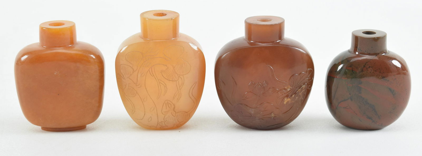 4 snuff bottles. China. 19th century. Agate. 2 with relief, engraved surfaces. Largest 2in. (1 of 9)