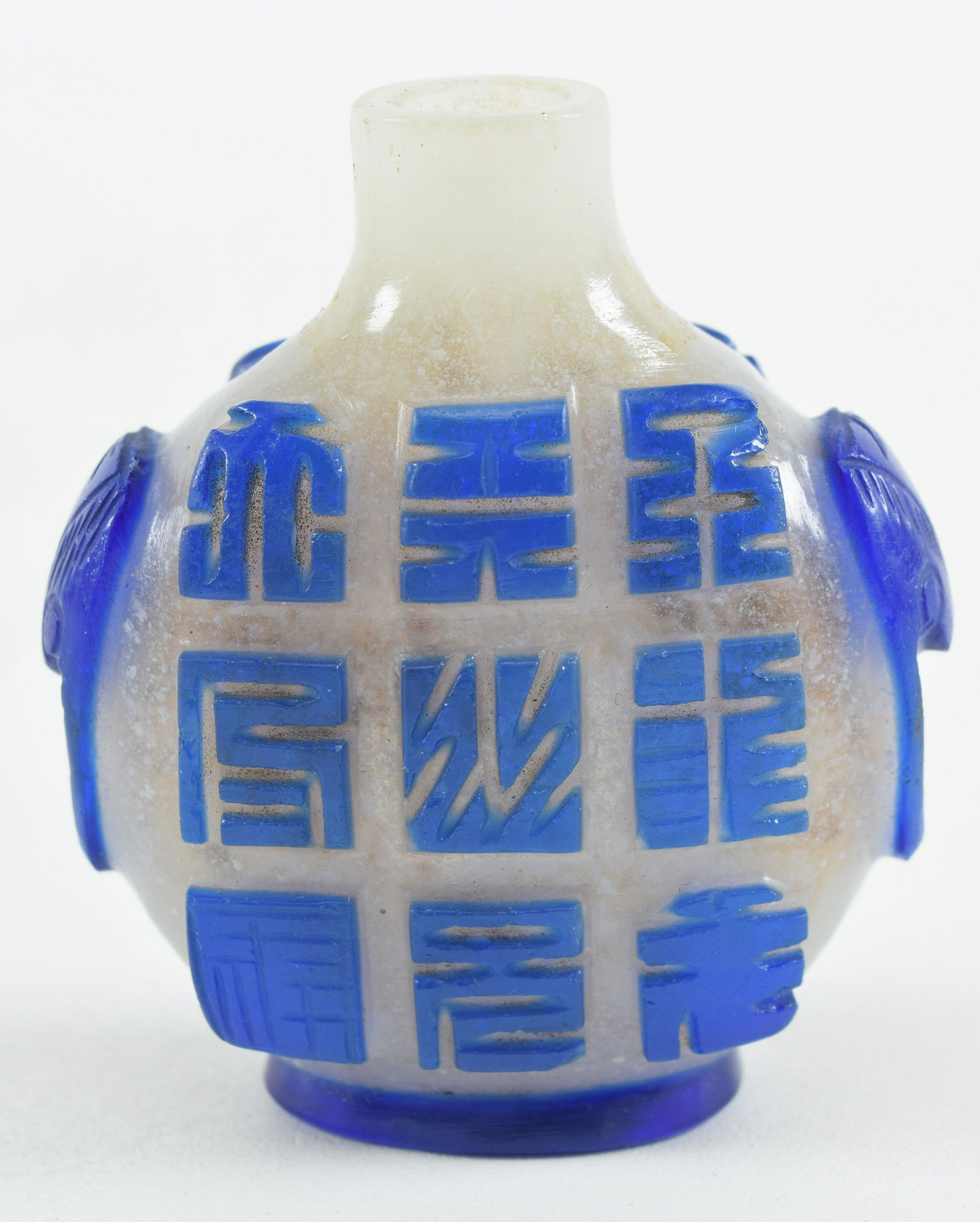 Peking glass snuff bottle. China. 19th century. Snowflake cut to blue with the hundred forms of (1 of 6)