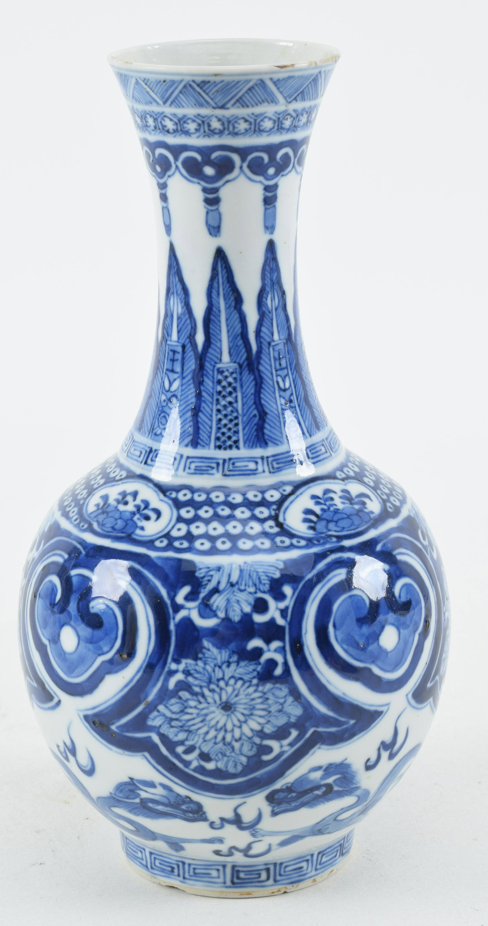 Porcelain vase. China. Early 20th century. Underglaze blue decoration of ju-i, flowers and dragons.: Porcelain vase. China. Early 20th century. Underglaze blue decoration of ju-i, flowers and dragons. Rim frits to the mouth and foot. 9in high.