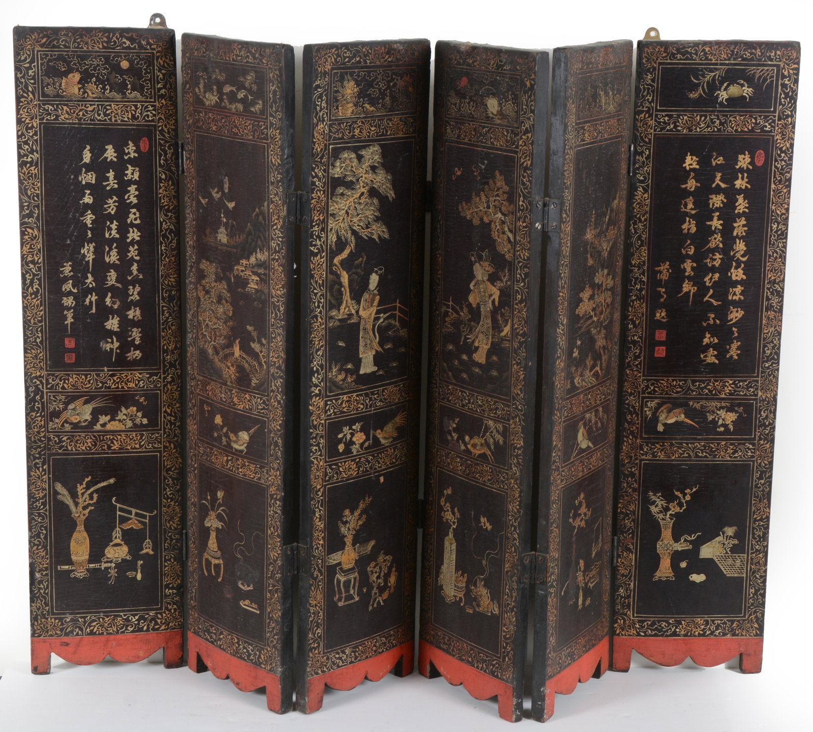 Carved folding wood screen, China 20th Century: Carved folding wood screen, China 20th Century. Lacquered and decorated with figures and flowers. Each panel measures 31.5 x 7.25in.
