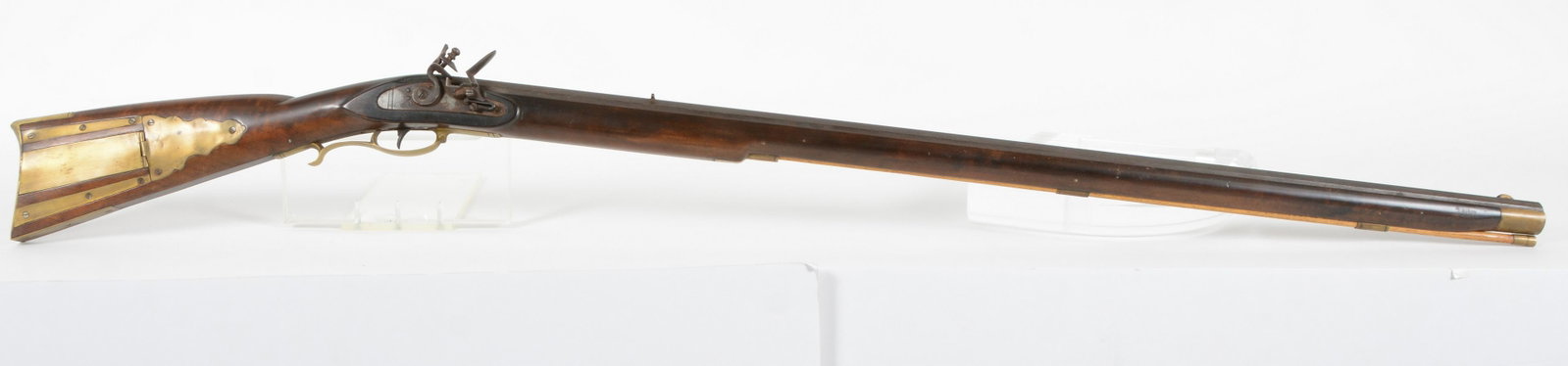 Contemporary Flintlock Rifle with Brass Patch Box. This rifle has a dark maple stock with some light: Contemporary Flintlock Rifle with Brass Patch Box. This rifle has a dark maple stock with some light curl in the butt stock and nicely fitted brass furniture. Barrel is octagon being 39-3/8" long with