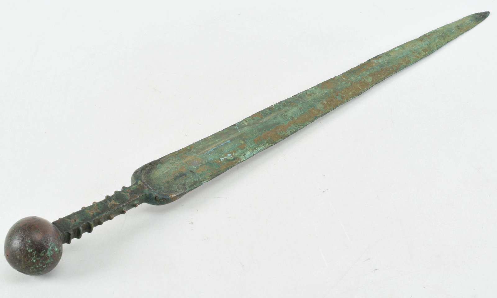 Ancient Bronze Age Luristan Plateau Style Dagger. This complete Bronze 1800 - 600 BC example is a: Ancient Bronze Age Luristan Plateau Style Dagger. This complete Bronze 1800 - 600 BC example is a seldom observed type sword having a large spherical solid ball pommel 1-3/4" diameter, a 17-3/4" long