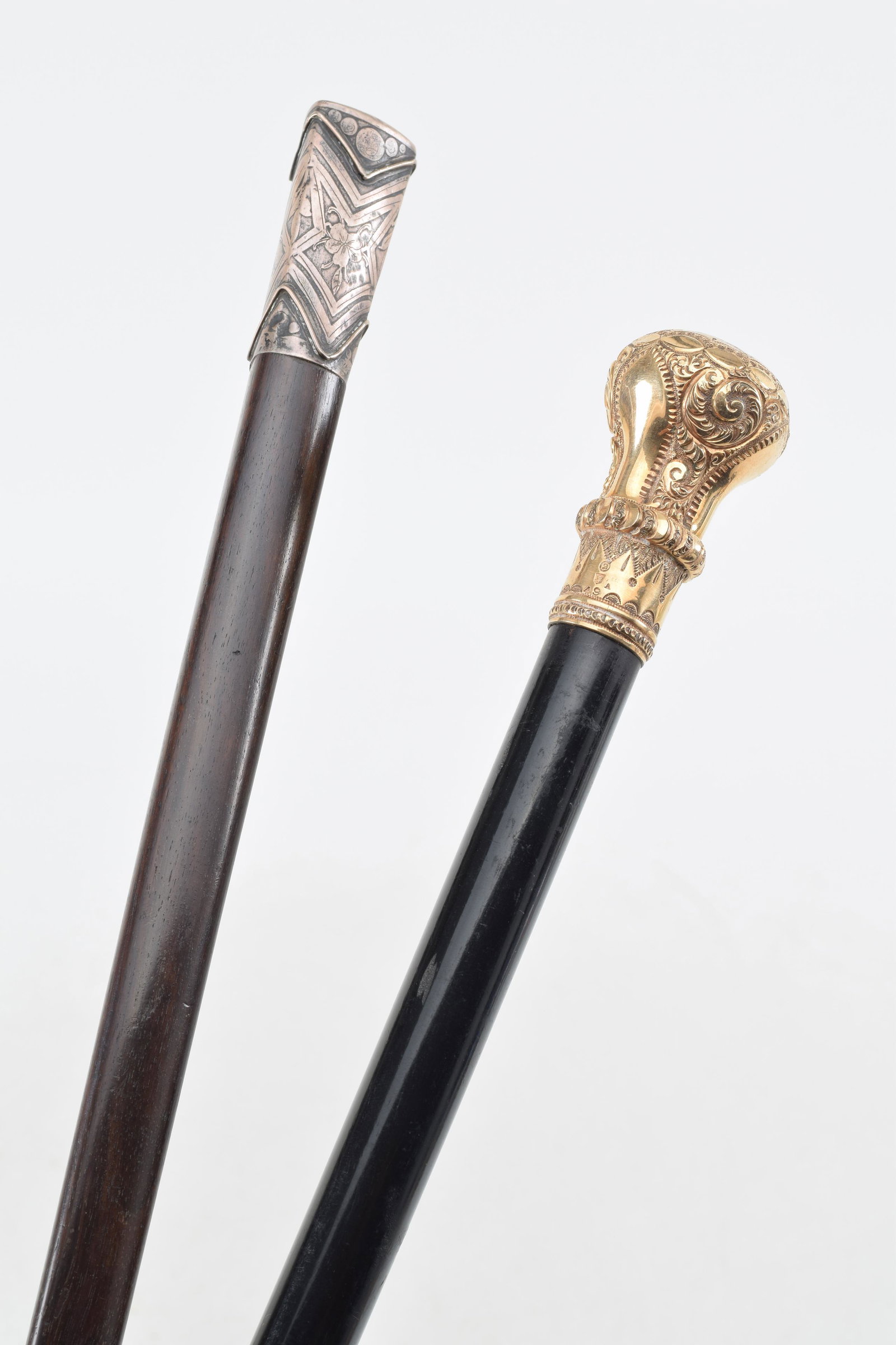 Gold and silver topped canes. Sterling silver topped cane in triangular form with geometric floral: Gold and silver topped canes. Sterling silver topped cane in triangular form with geometric floral decoration. Gold or gold filled cane head with inscription "Dayton Branch Letter Carriers Association