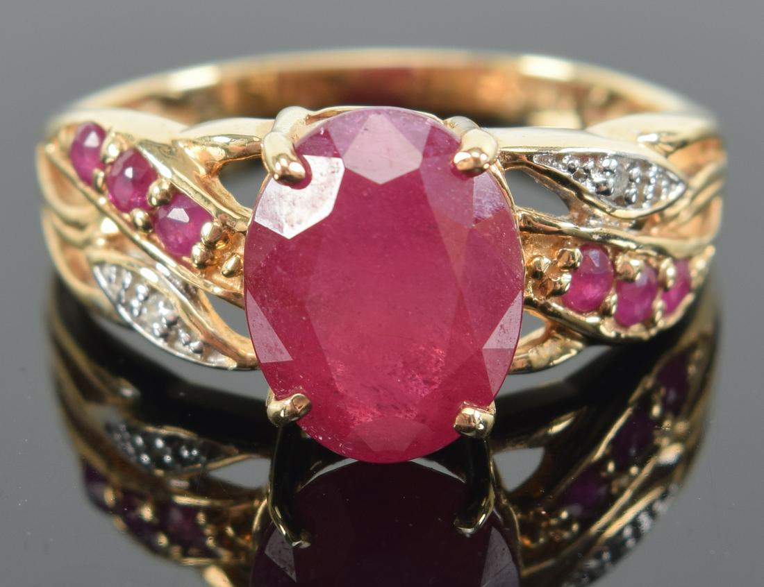 14K gold ruby mounted ring. Marked 14K. Center stone 9.7 x 7.3mm. (1 of 7)