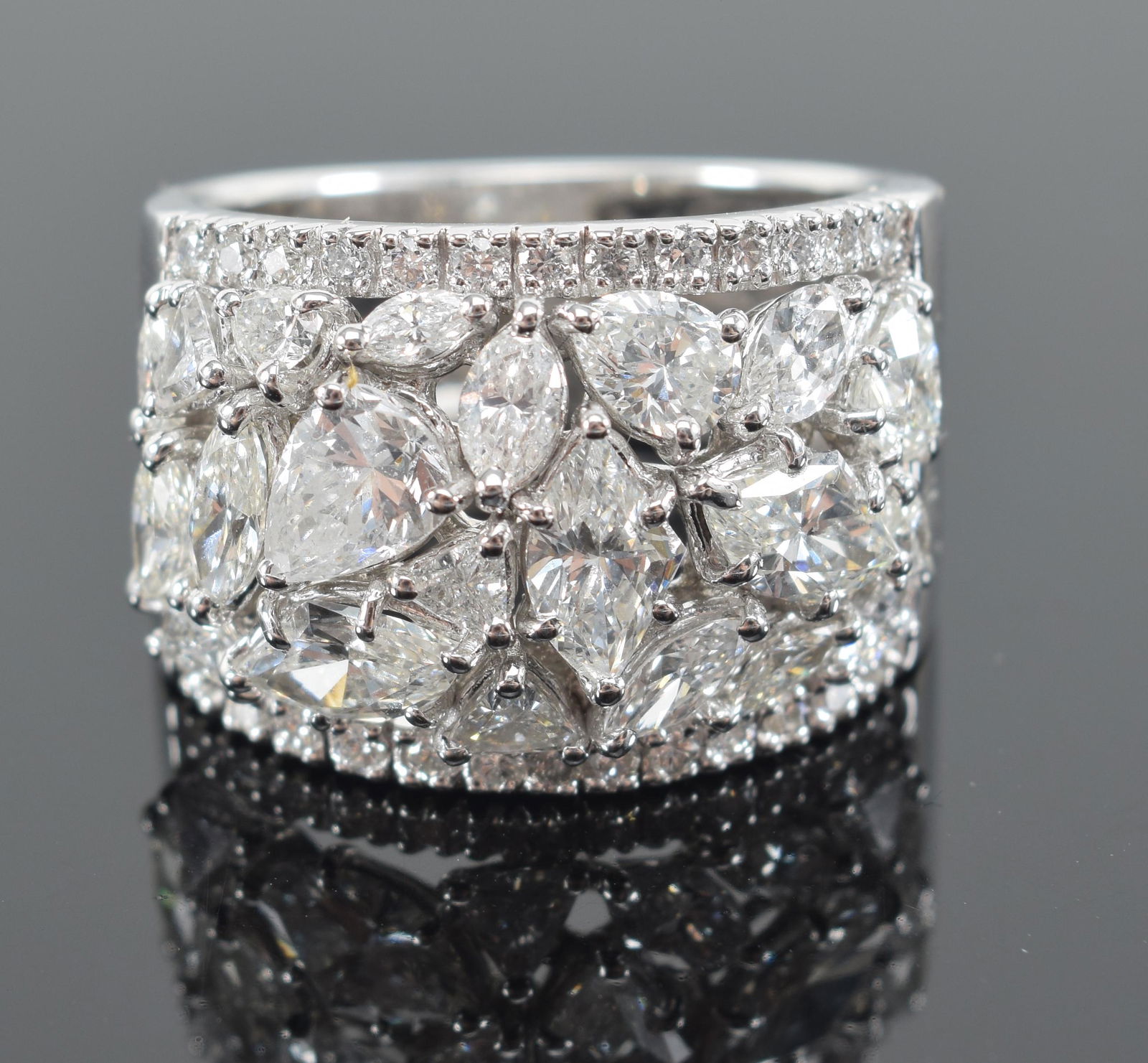 18K gold diamond cluster band. White gold with approx. 3.3 CTW diamonds. Marked 18K DO and serial (1 of 8)