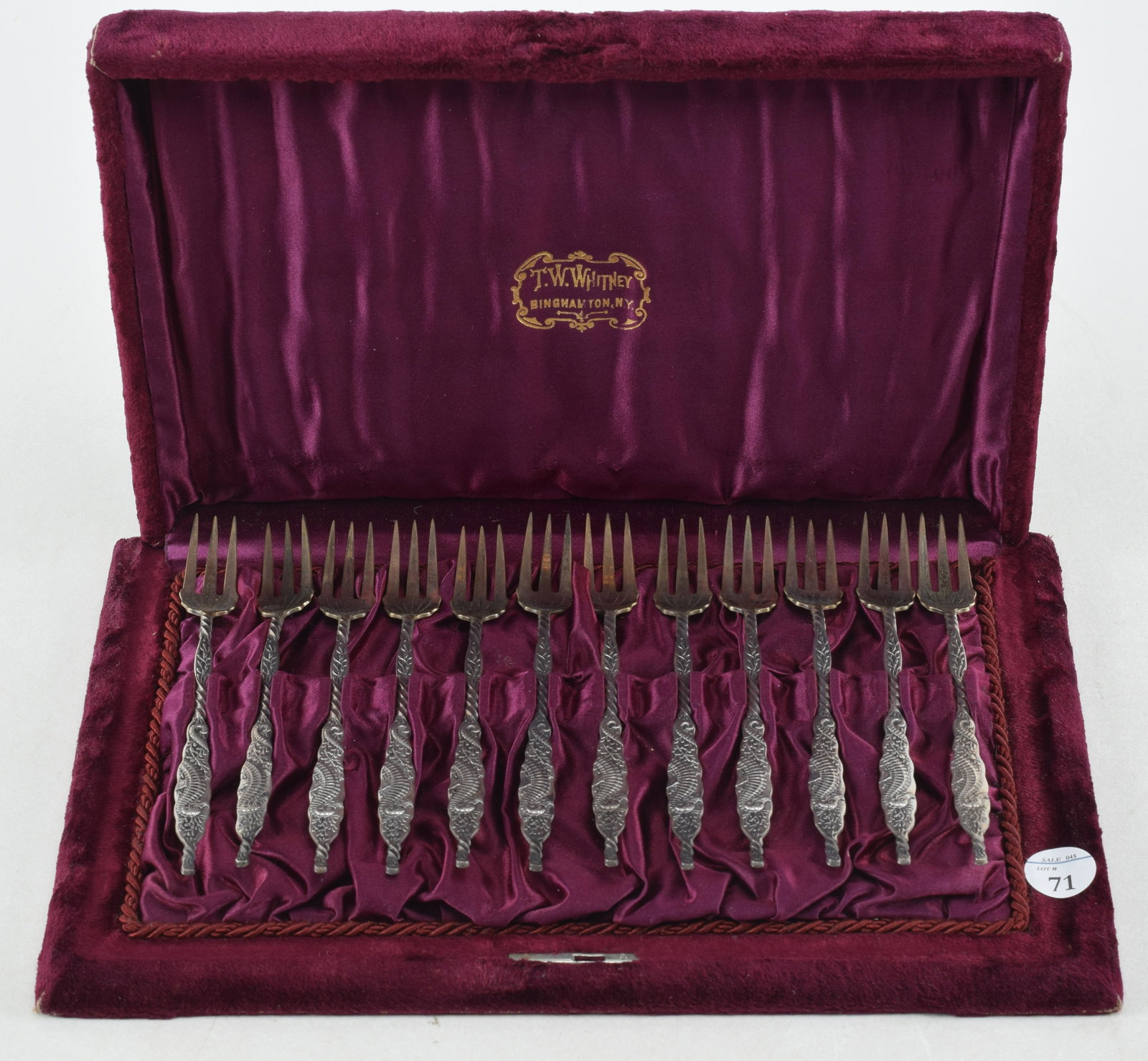 Whiting sterling silver "Seahorse" cocktail or seafood forks. Velvet cased set of 12 forks. Case: Whiting sterling silver "Seahorse" cocktail or seafood forks. Velvet cased set of 12 forks. Case marked T. W. Whitney, Binghamton N.Y. Forks with gold washed heads twisted handles and relief decorated