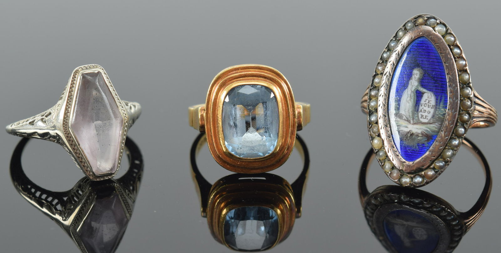 3 gold rings. 1) Early 19th century gold pearl mounted enameled mourning ring. Scratches to enamel. (1 of 8)