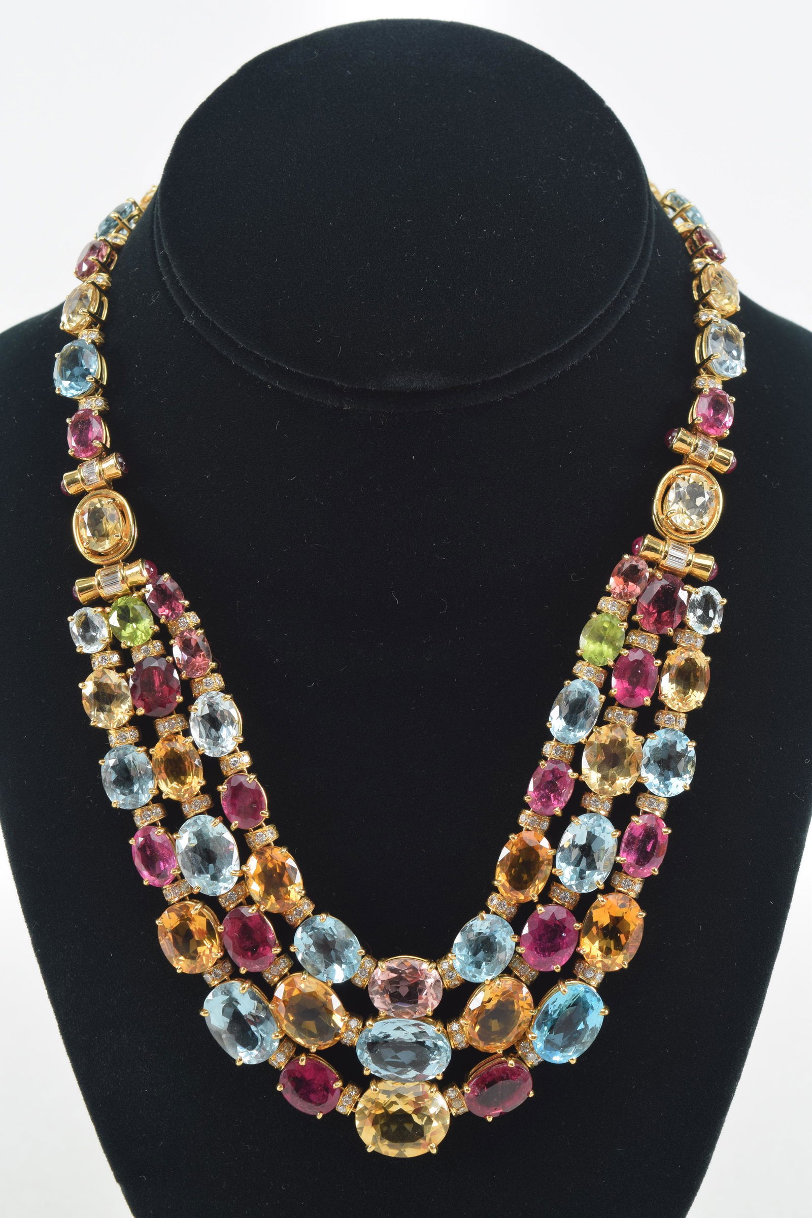 18K gold semi precious stone mounted necklace. Heavy gold backing. Stones include tourmaline and (1 of 9)