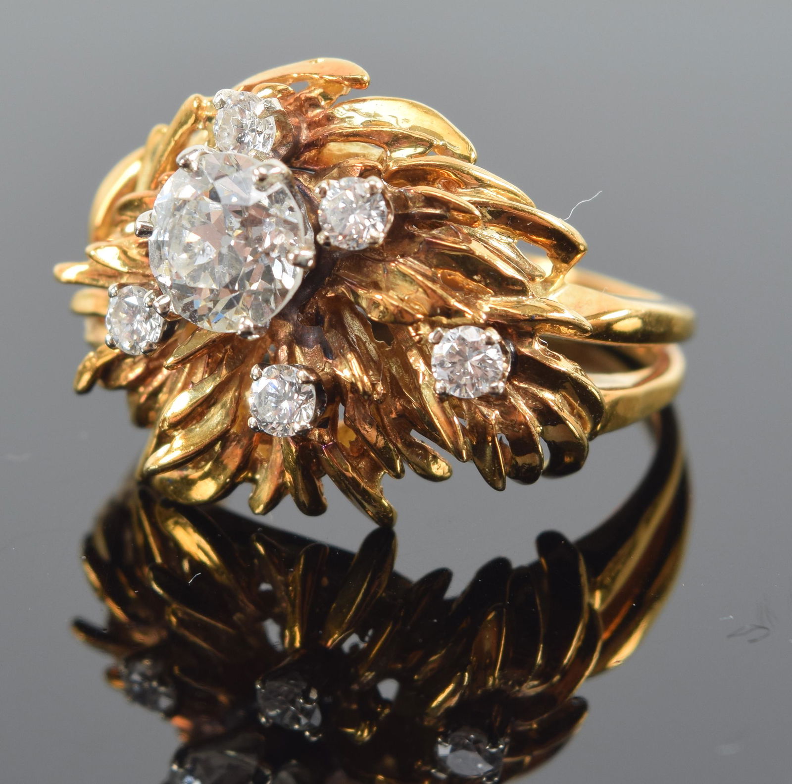 18K gold diamond mounted cluster ring. Leaf design. Center large stone approx. 5.8 mm diameter. (1 of 7)