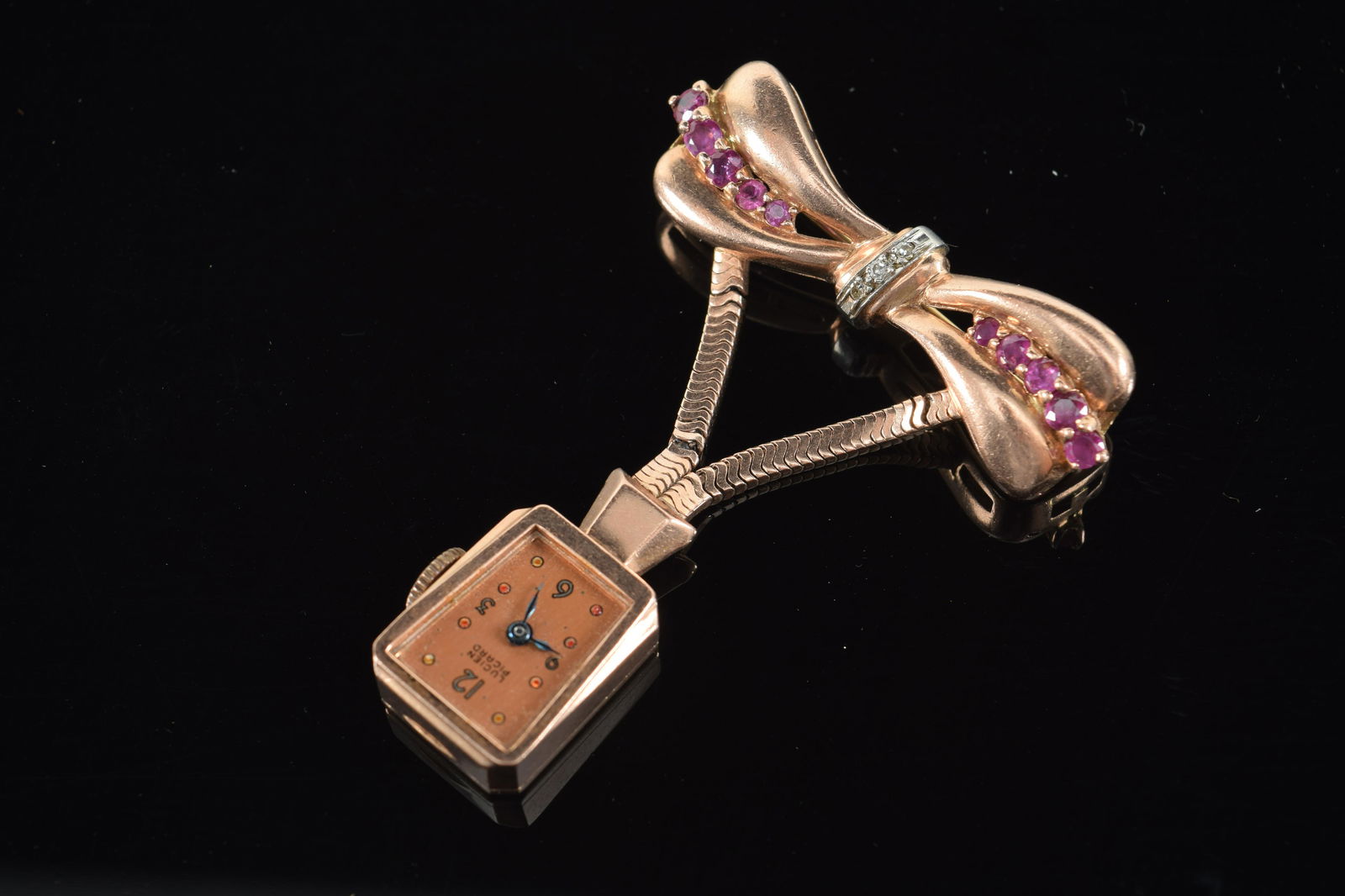 Lucien Piccard 14K rose gold ribbon form ruby and diamond mounted pin pendant watch. Marked 14K. (1 of 6)