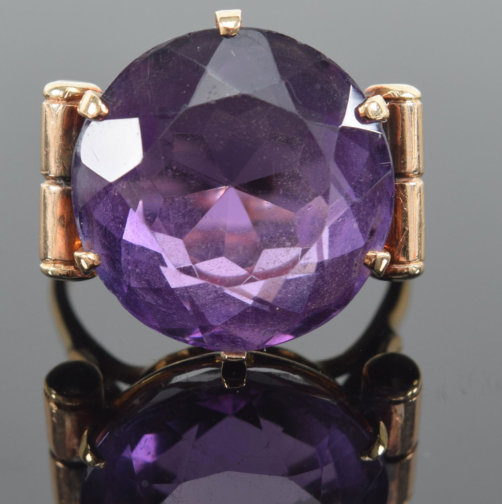 14K gold amethyst mounted large ring. Stone measures approx. 0.75in diameter. Marked 14K. (1 of 7)